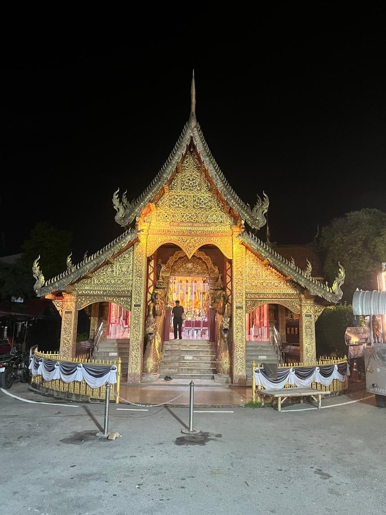 Temple glowing gold at night